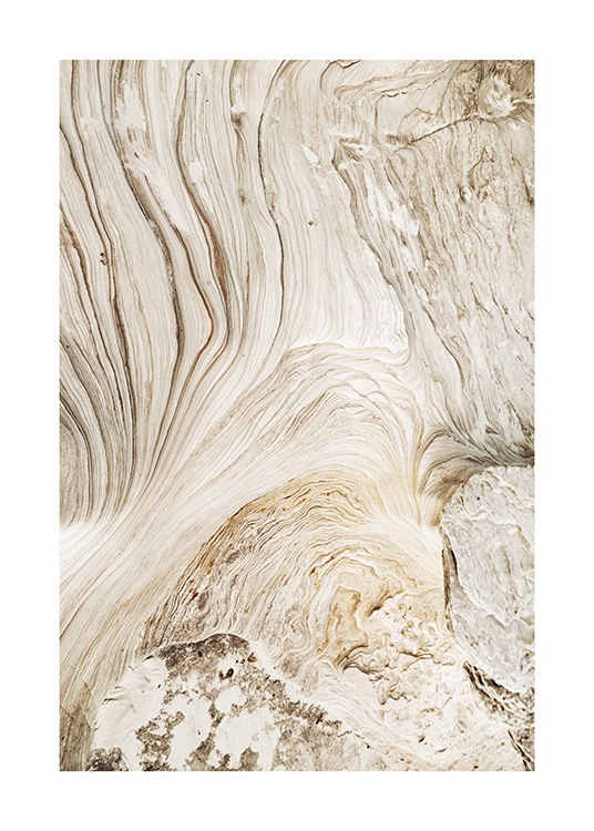  – Fotografi av en beige klippa med ett virvlande, abstrakt mönster