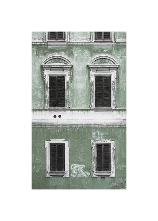  – Foto av en grön fasad med gammaldags känsla och svartvita fönster