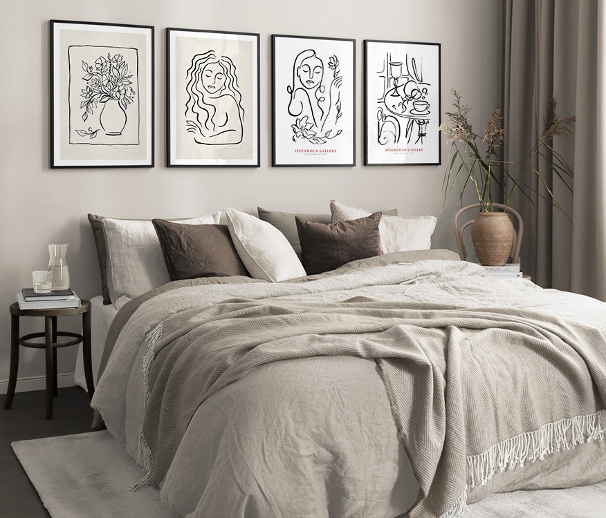 Malade illustrationer i svartvitt och beige i sovrum